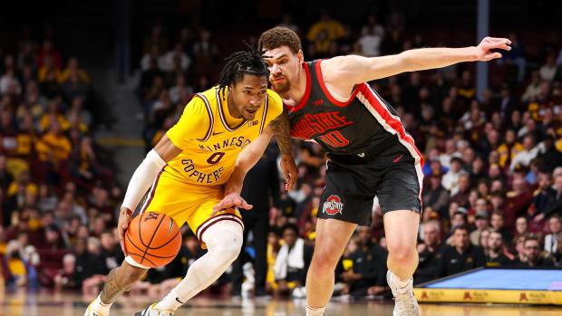Minnesota guard Elijah Hawkins (0) works around Ohio State forward Jamison Battle (10) during the first half at Williams Arena in Minneapolis on Feb. 22, 2024.